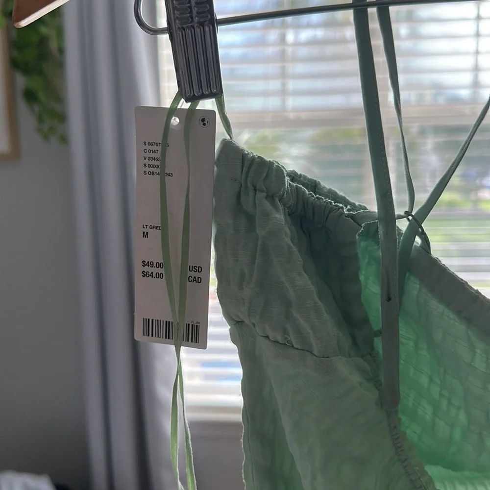 Urban outfitters light green ruched body suit size medium artsy tie front